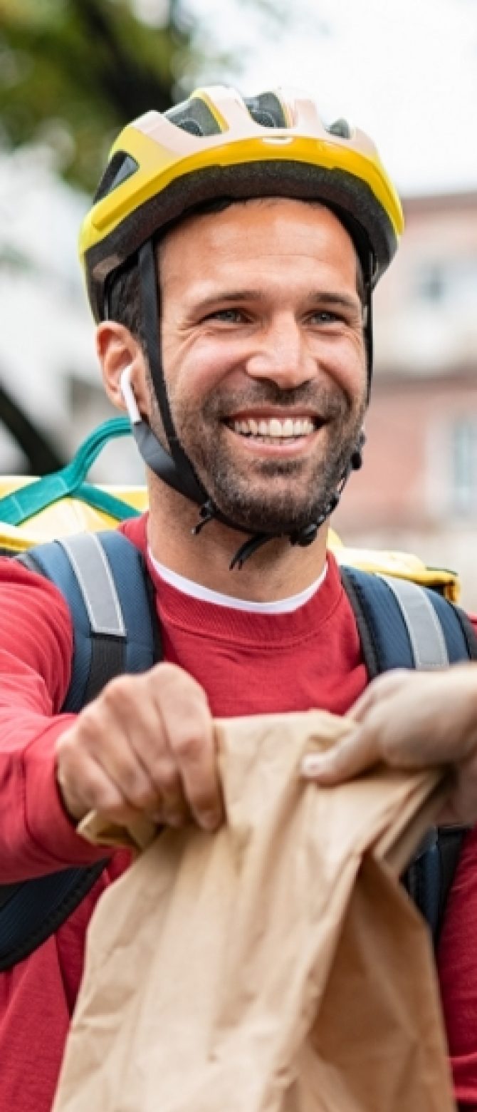 delivery-man-giving-take-away-food-DBXUQTG.jpg